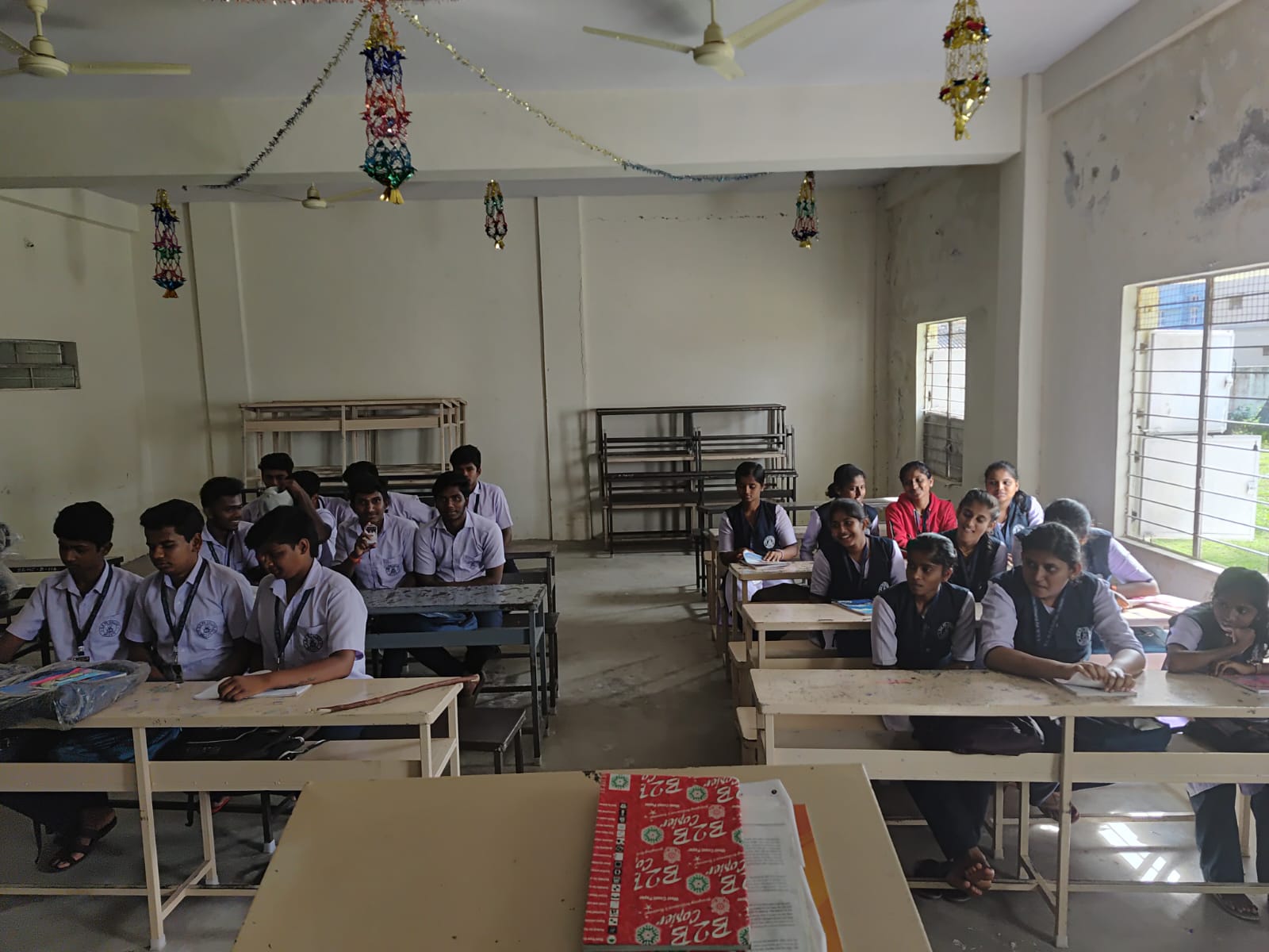 Students seated in a classroom at the Melkote college