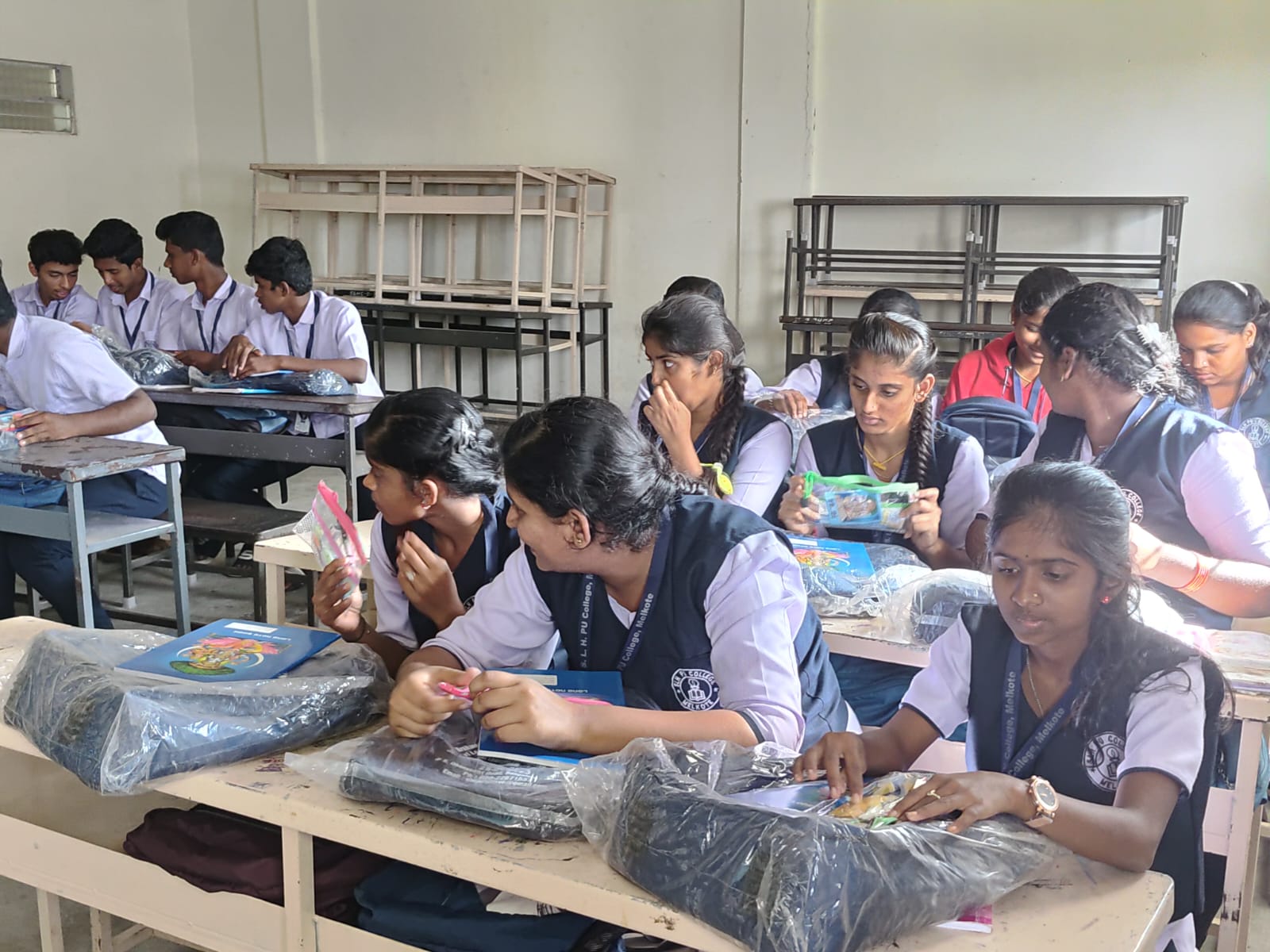 Students seated with newly distributed support materials